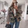 Annora dark blue-black and beige striped-sleeve tropical-print blazer, model front view