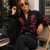 EA-CH170-1 Solene black blouse, close front view of pink floral stems and frilled neckline