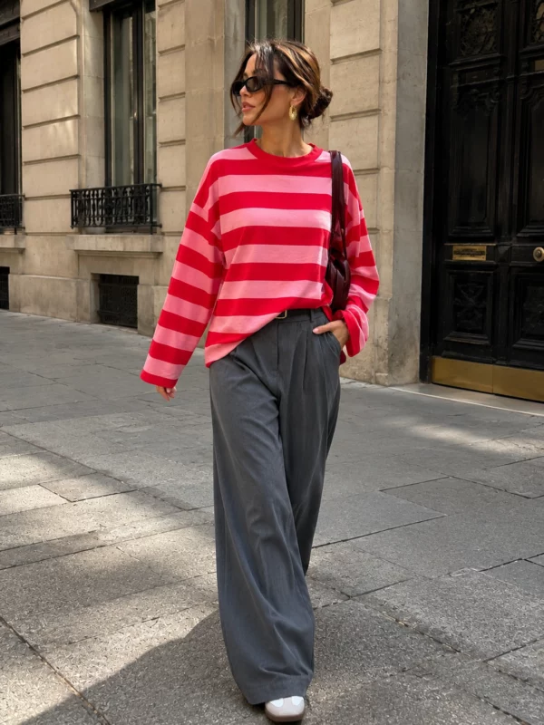 EA-TE567-3 Model wearing the Amelie red and pink striped T-shirt with grey trousers, full-length front view