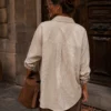 EA-Ch305-2 Maelle taupe shirt, back view of centre pleat and curved hem