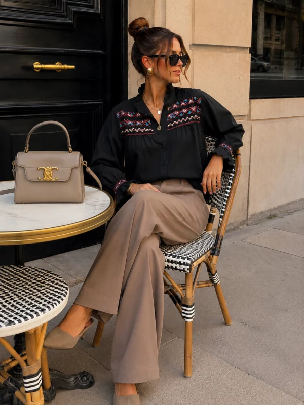 EA-CH161-4 Lison black blouse, seated view showing neckline and cuffs