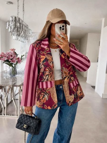 IF-15224-1 Annora pink and wine striped-sleeve blazer with tropical leaves and leopard figures on a model