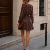 EA-CH338-5 Apolline plum paisley dress, rear view showing long sleeves and flared skirt
